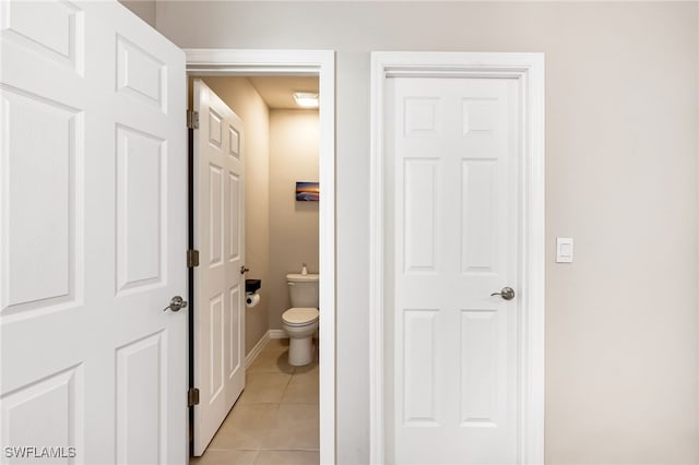 bathroom featuring tile patterned floors and toilet