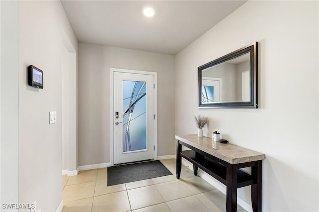 entryway with light tile patterned flooring