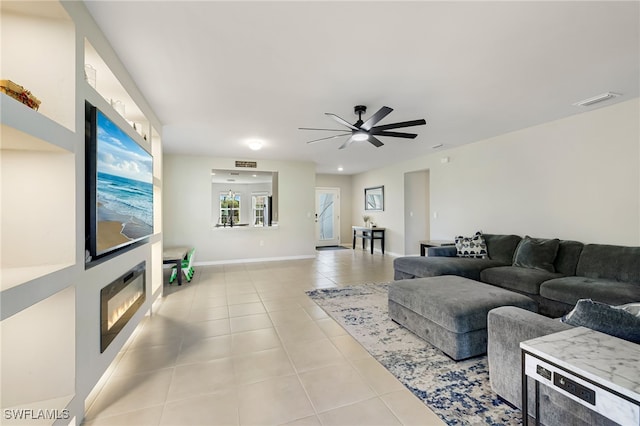 tiled living room with ceiling fan