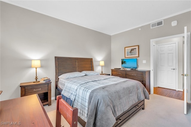 bedroom featuring ornamental molding, visible vents, and baseboards