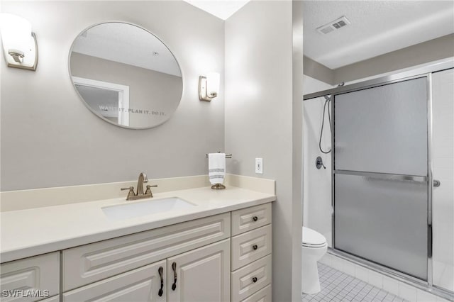 900 Arbor Lake Dr Unit 9-101, Naples, FL 34110 - bathroom with tile patterned floors, vanity, toilet, and a stall shower