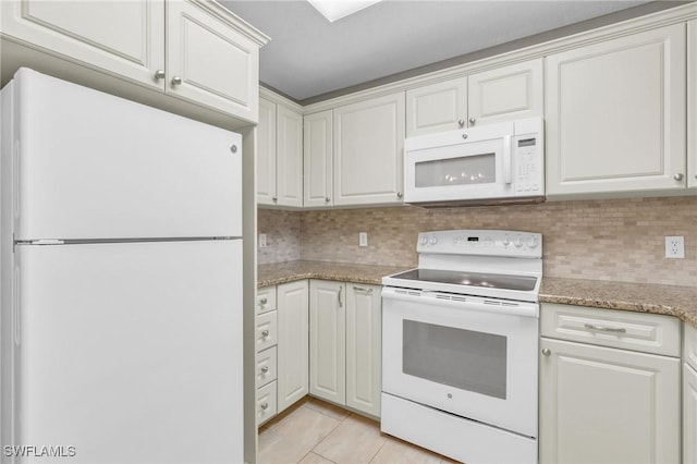 900 Arbor Lake Dr Unit 9-101, Naples, FL 34110 - kitchen featuring white appliances, light tile patterned flooring, backsplash, and white cabinetry