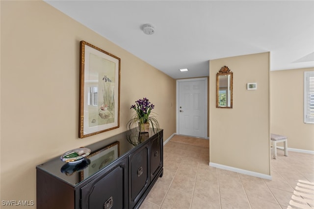 hallway with light tile patterned floors