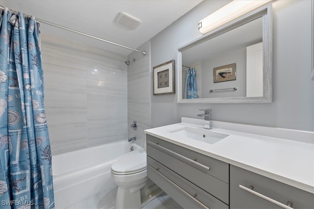 full bathroom featuring vanity, shower / tub combo, and toilet