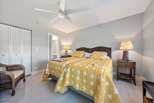 bedroom featuring ceiling fan and a closet