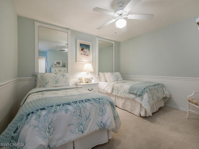 bedroom featuring ceiling fan and carpet floors