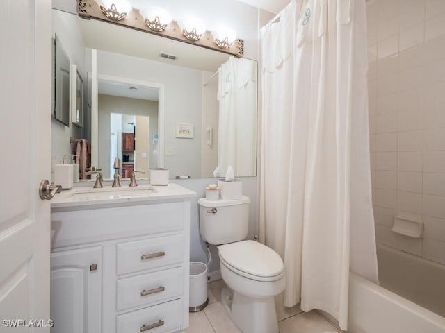 full bathroom featuring tile patterned floors, toilet, vanity, and shower / tub combo