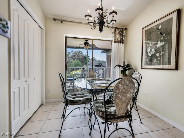 dining space with light tile patterned floors and a chandelier