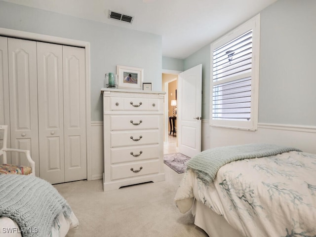 carpeted bedroom featuring a closet