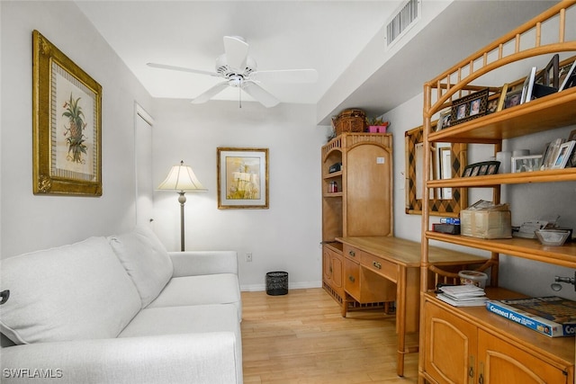 office featuring ceiling fan and light hardwood / wood-style floors