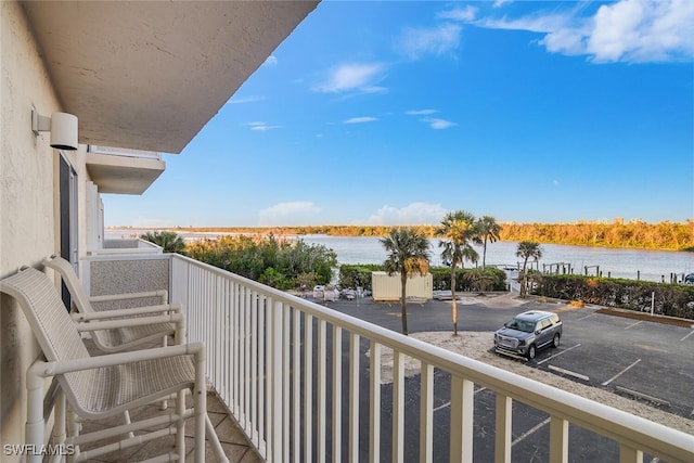 balcony featuring a water view