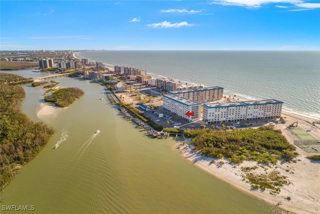 bird's eye view with a water view and a beach view