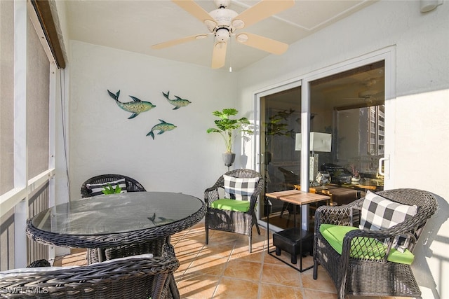 sunroom featuring ceiling fan