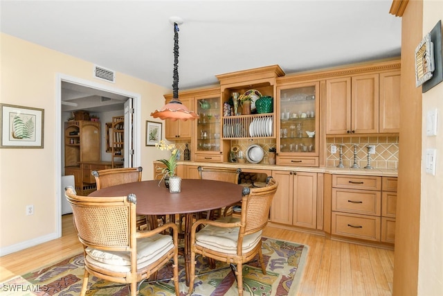 dining area with light hardwood / wood-style flooring