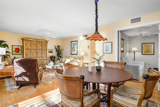 dining area with light hardwood / wood-style floors