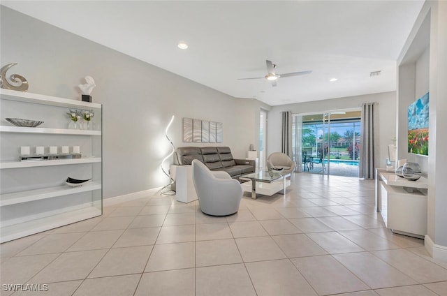 tiled living room featuring ceiling fan