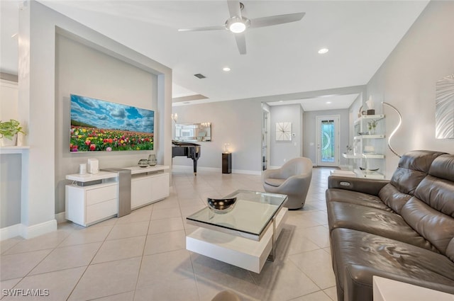 tiled living room with ceiling fan