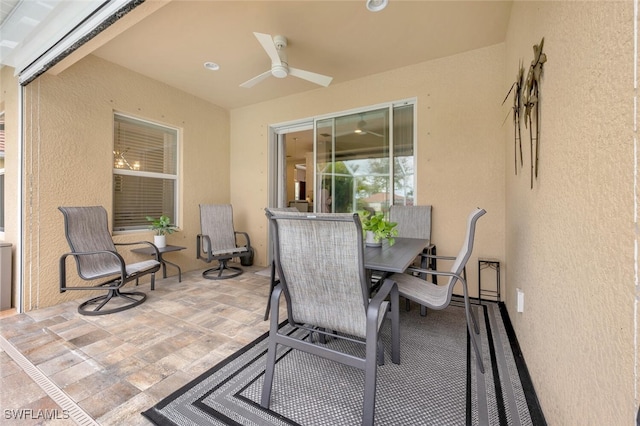 view of patio featuring ceiling fan