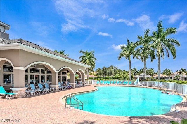 view of swimming pool featuring a patio area