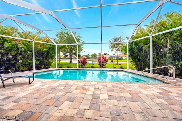 view of swimming pool with a lanai and a patio