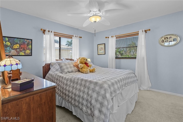 bedroom with light colored carpet and ceiling fan