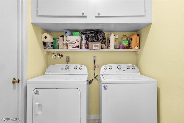 clothes washing area featuring washer and clothes dryer