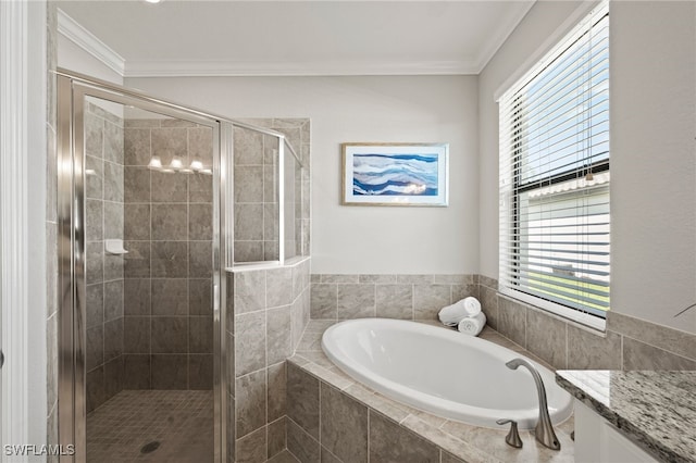 bathroom with separate shower and tub, vanity, and ornamental molding