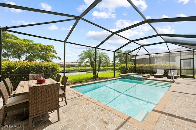 view of swimming pool featuring a patio area, a lanai, an in ground hot tub, and a water view