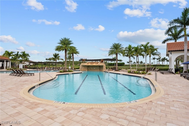 view of swimming pool featuring a patio area