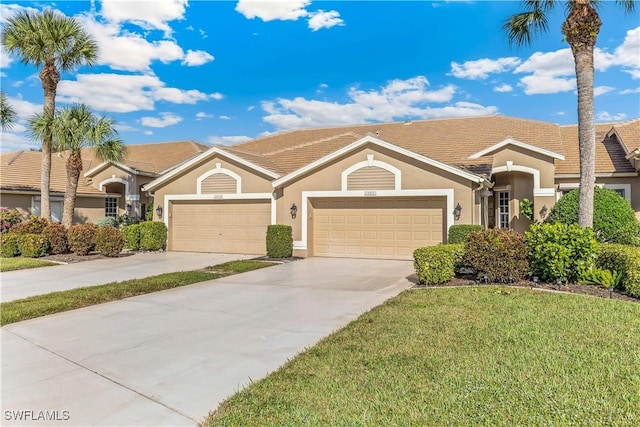 single story home featuring a front lawn and a garage