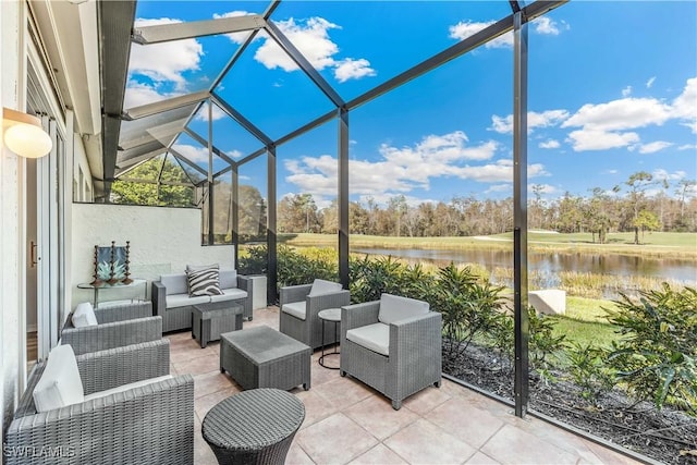 sunroom / solarium featuring a water view