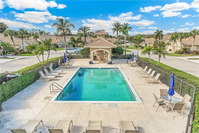 view of pool with a patio area and an outdoor fireplace