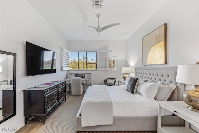 bedroom featuring hardwood / wood-style flooring and ceiling fan