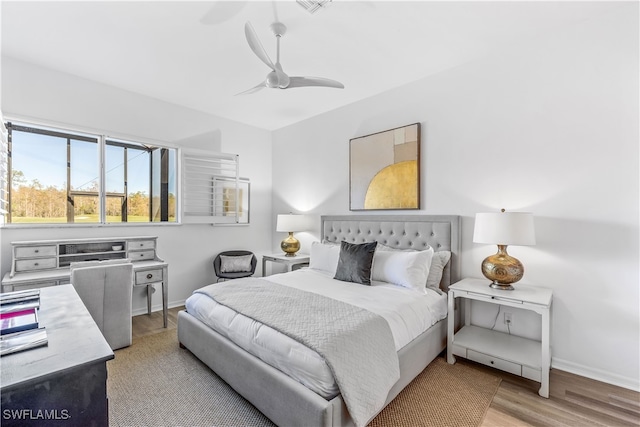 bedroom featuring ceiling fan and light hardwood / wood-style floors