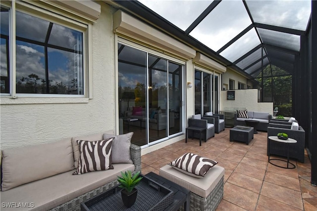 view of patio with outdoor lounge area and a lanai