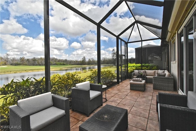 view of patio featuring a water view, a lanai, and an outdoor hangout area