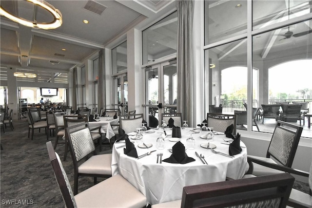 dining space featuring visible vents, french doors, beamed ceiling, and carpet flooring