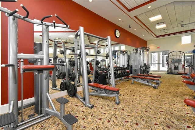 gym with french doors and carpet flooring