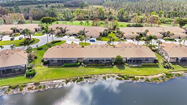 birds eye view of property with a water view and a residential view