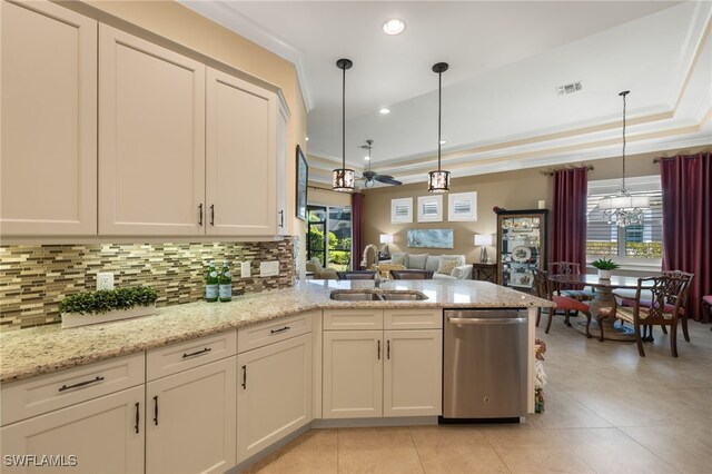 kitchen with sink, crown molding, light stone counters, stainless steel dishwasher, and pendant lighting