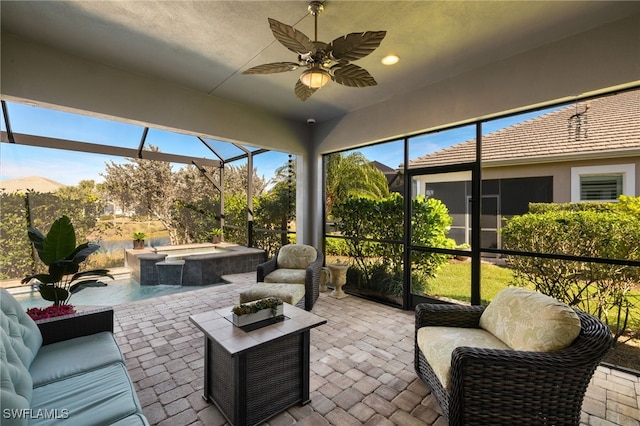 sunroom featuring ceiling fan