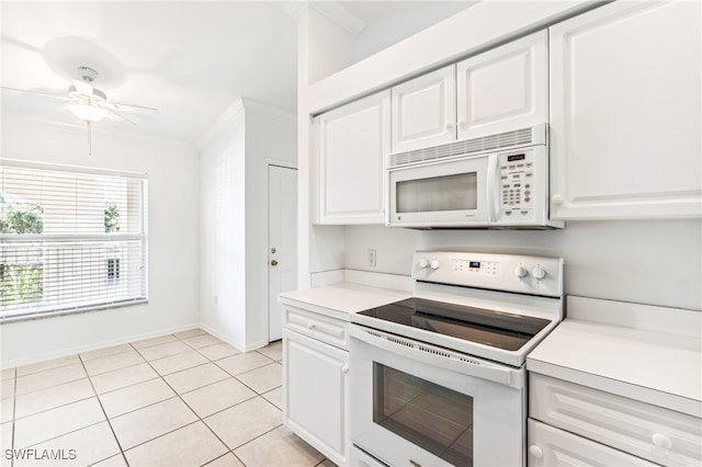 kitchen featuring white cabinetry, light tile patterned flooring, white appliances, and ornamental molding