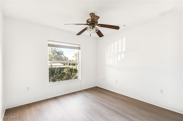 unfurnished room with hardwood / wood-style flooring and ceiling fan