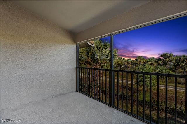 view of balcony at dusk