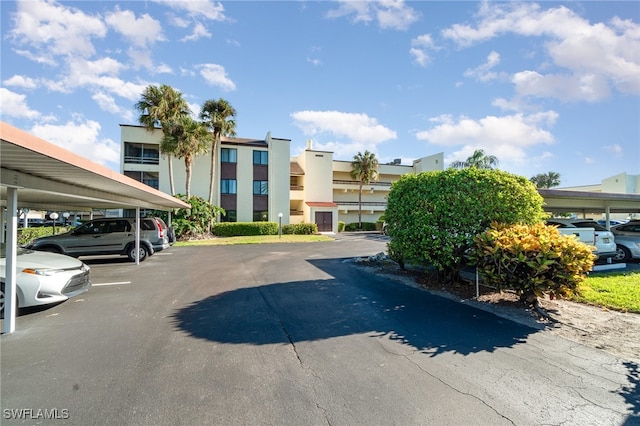 view of vehicle parking with a carport