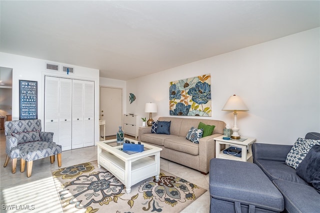 living room with light tile patterned flooring