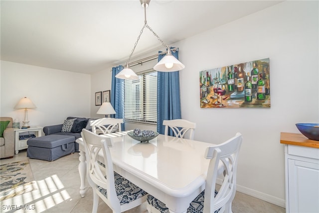 dining space featuring light tile patterned floors