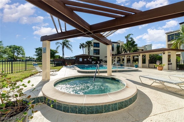 view of pool featuring a pergola, a patio, and a hot tub