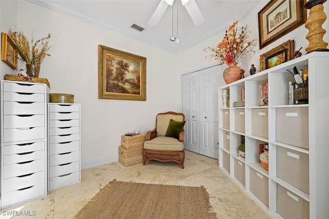 sitting room with ceiling fan and ornamental molding