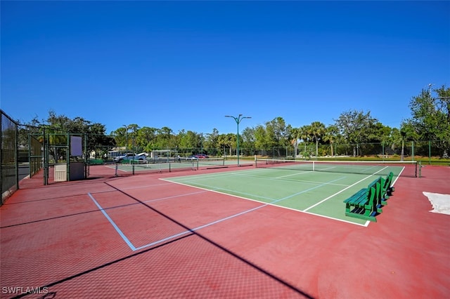 view of sport court with basketball hoop